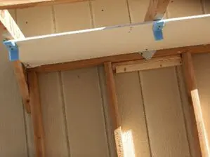 Drywall taped to wooden beams