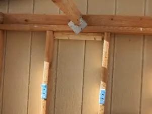 Wooden framing with metal brackets